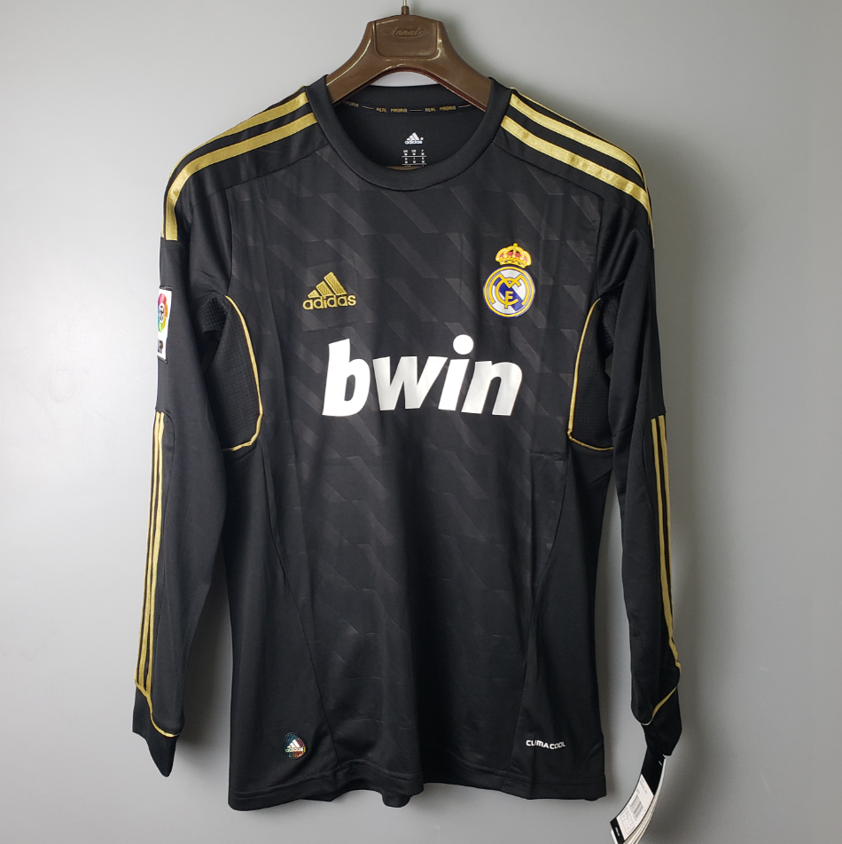 Camisa Manga Longa Real Madrid 2012 Adidas – Preto        <span class="lbx-verified" aria-label="Produto verificado">
            <img src="https://cdn-icons-png.flaticon.com/512/1828/1828640.png" alt="Produto verificado">
        </span>